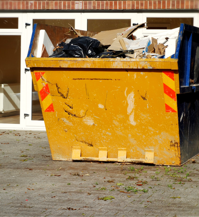 Skip outside a house